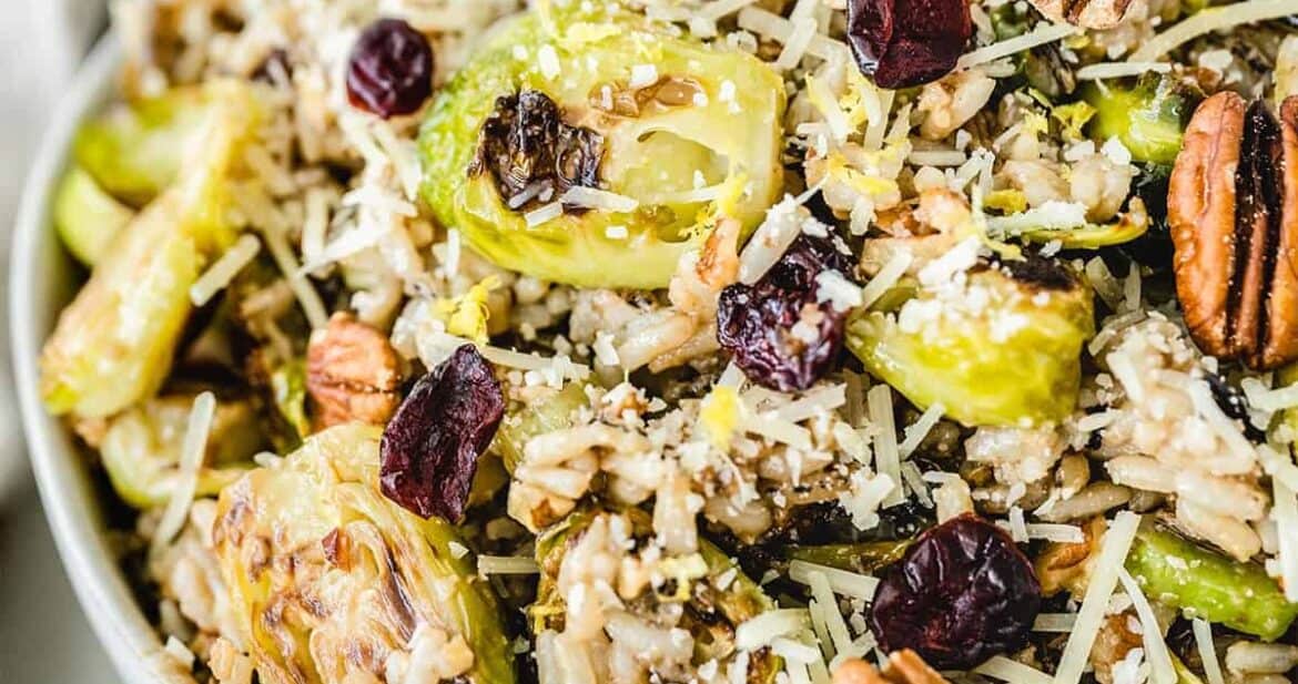 Close up of roasted brussels sprouts salad in a white bowl