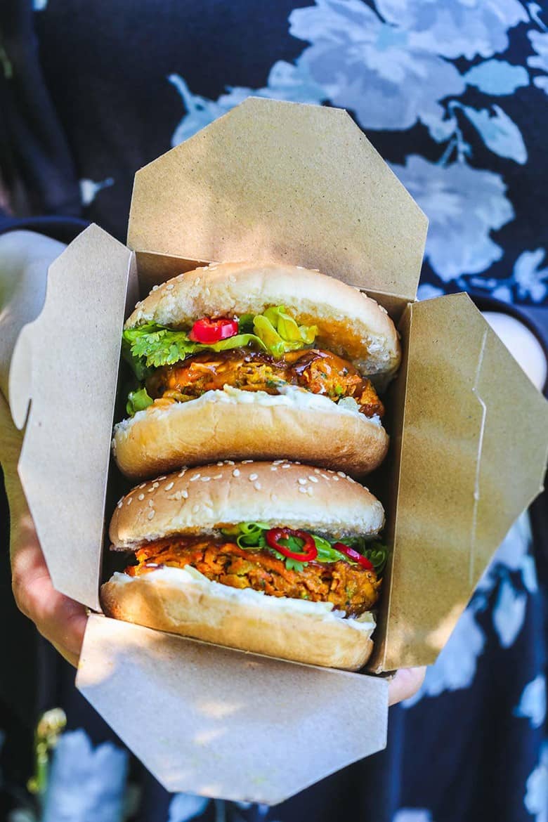 Two Vegan Bhaji Burgers served in a box by Little Sunny Kitchen