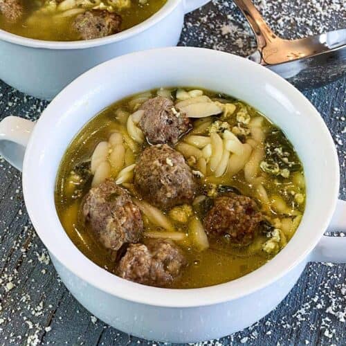 Italian wedding soup in two white bowls