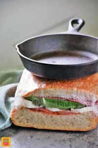 Wrap and gently press with skillet the Italian Pressed Sandwich