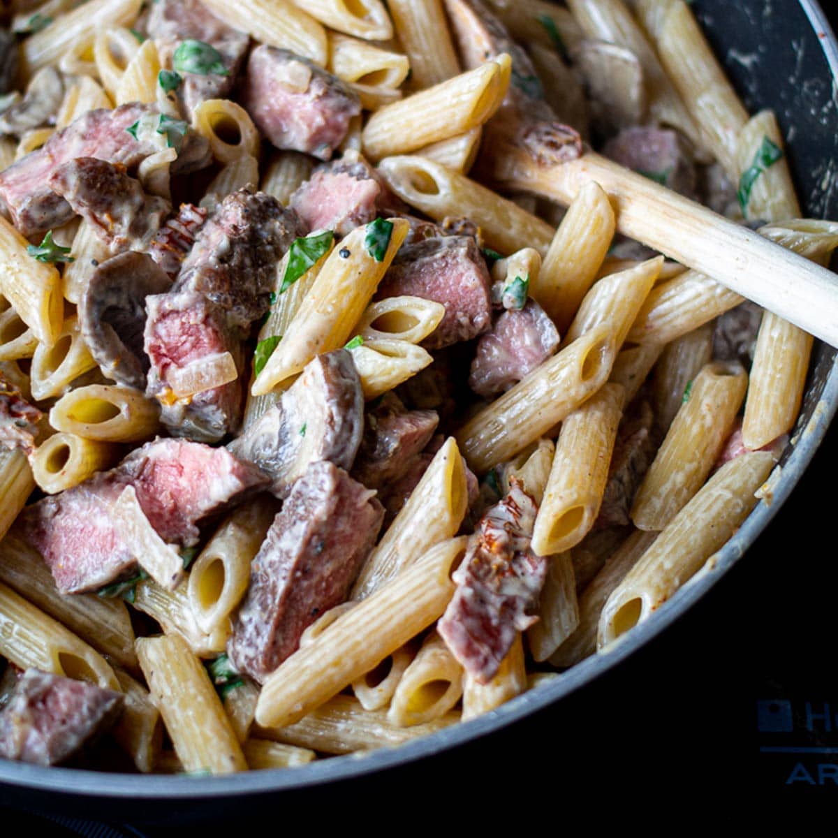 Creamy penne pasta in a skillet