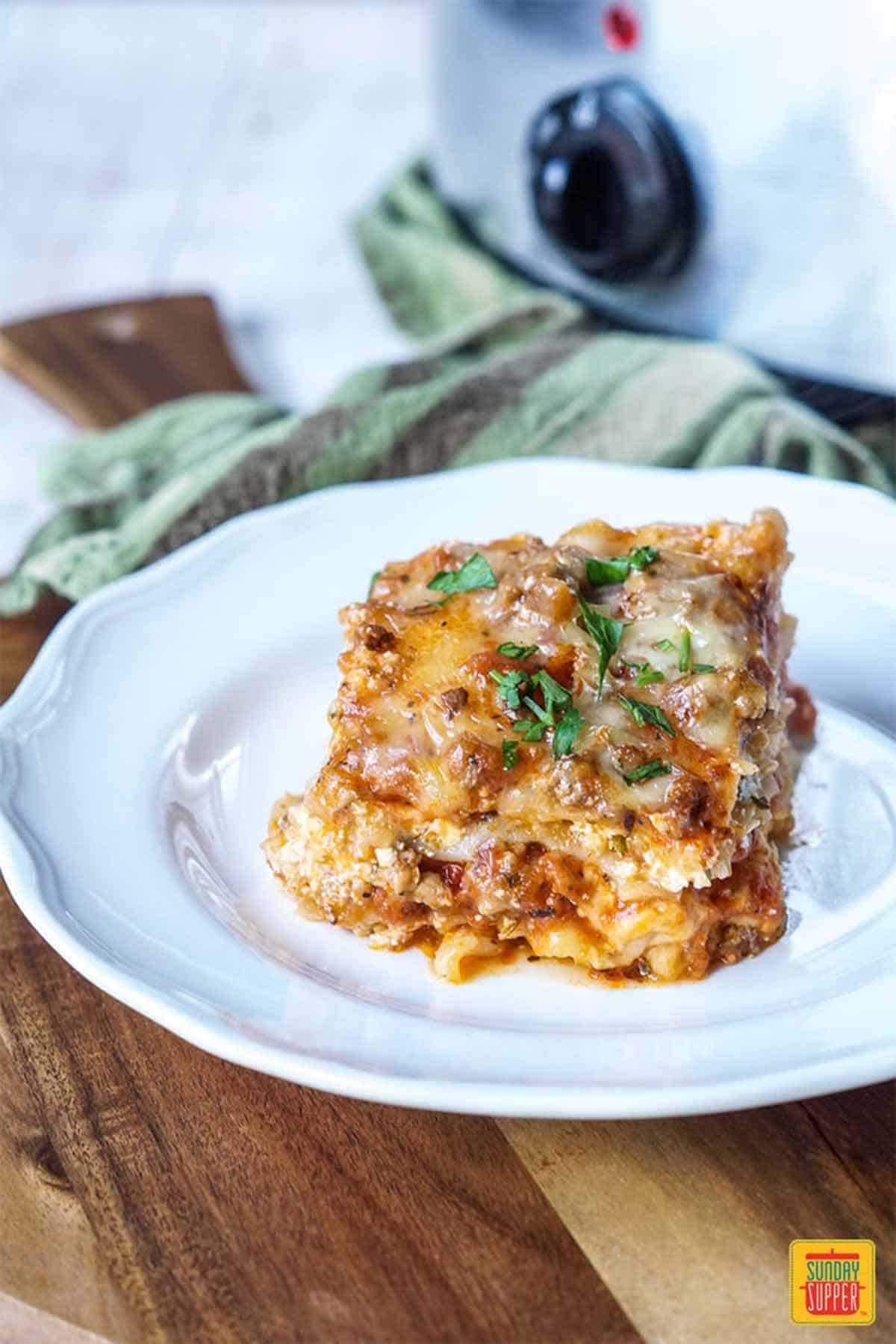 Slow cooker lasagna on a white plate