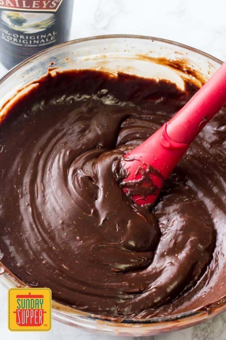 Mixing the melted chocolate to make Baileys Fudge