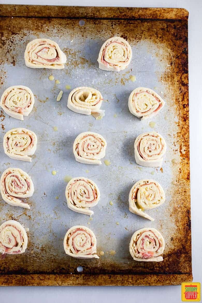 puff pastry pinwheels rolled on a baking sheet
