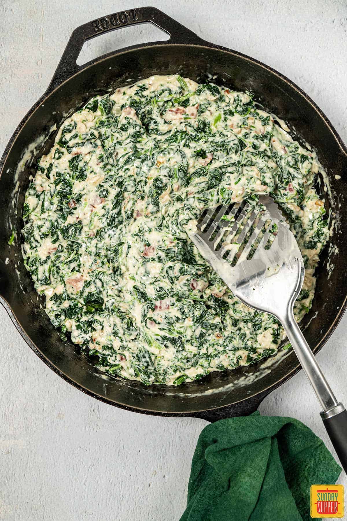 creamed spinach mixture in skillet