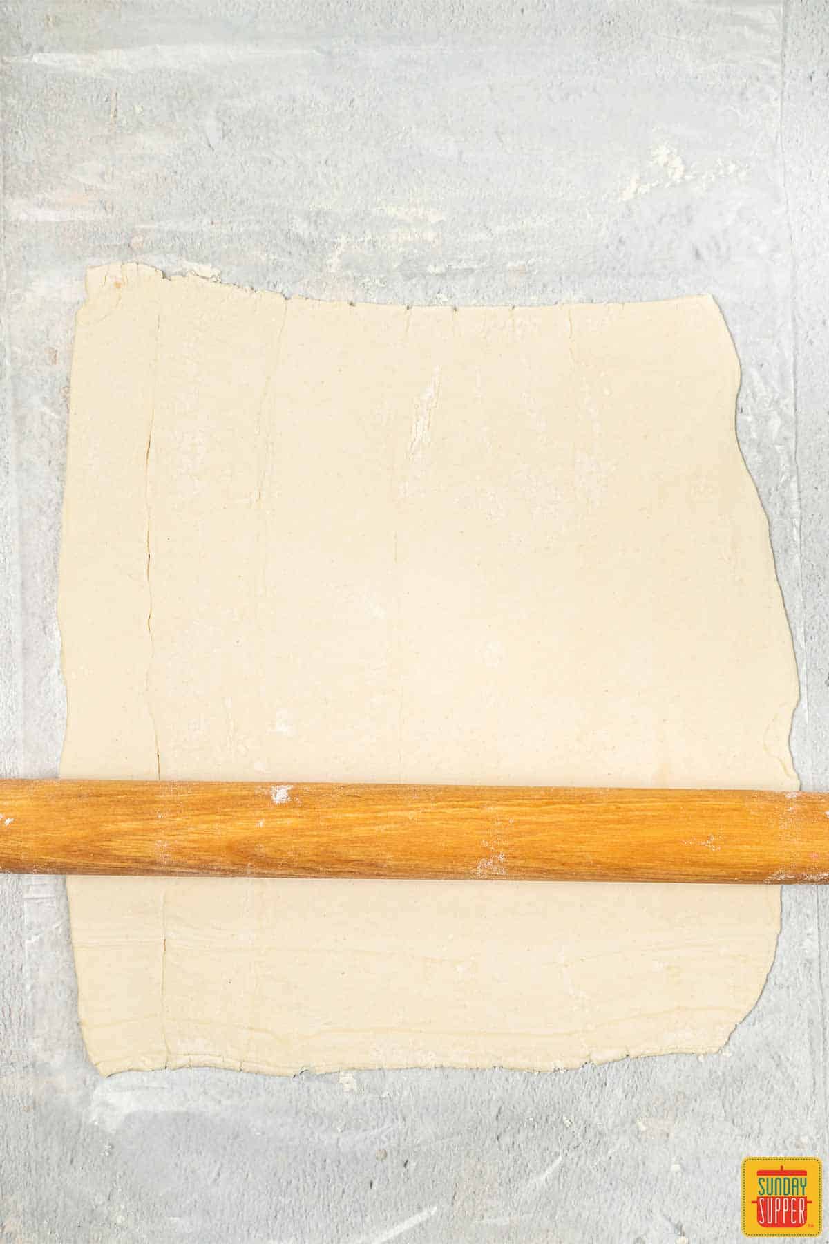 rolling out puff pastry sheets