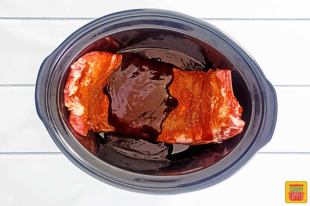 Slow cooker pork ribs in the crock pot ready to cook