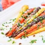 Parmesan Garlic Roasted Carrots on a white dish