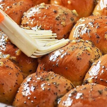 Brushing buttery mustard glaze on sliders