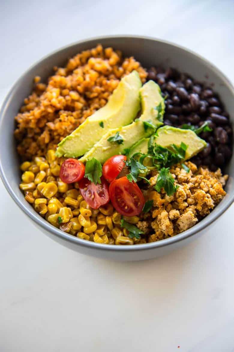 By taking just a little time on the weekend to prepare a menu, chop vegetables, and measure ingredients, you can create your own weekly meal plans on a budget. Make a list of your meal prep ideas, pick up the ingredients, and get prepping! Save money and time out of your week by planning ahead with your own meal prep dinners. You'll be glad that you did! #SundaySupper #mealplanning #mealprep #familydinner #menuplanning Turkey Taco Bowls with Cauliflower Rice