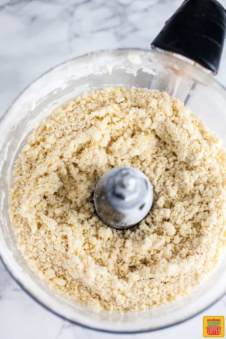 Mixing empanada dough in a food processor