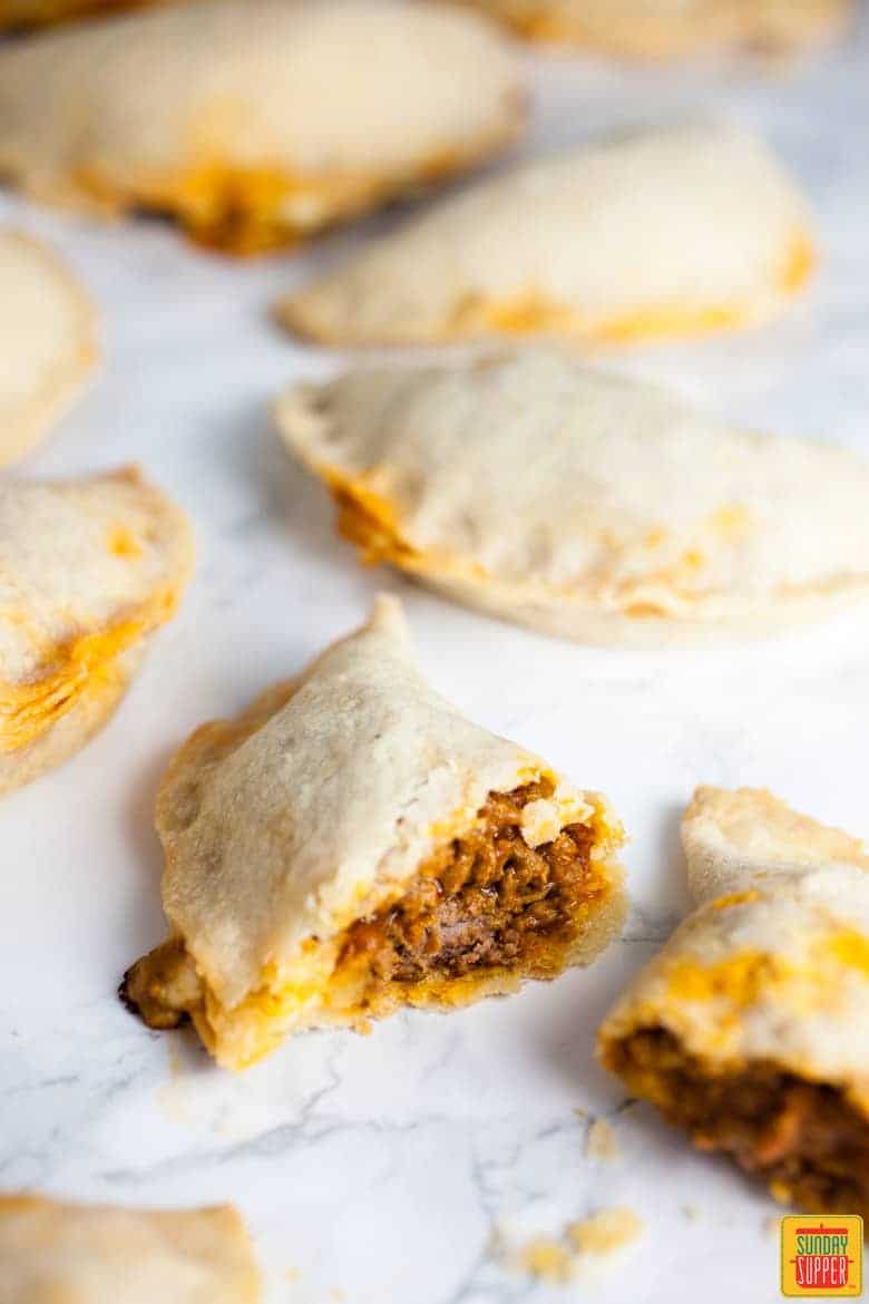 Baked Puerto Rican Meat Pies Empanadas on a white surface