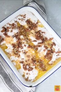 uncooked pumpkin crunch recipe ingredients in baking dish