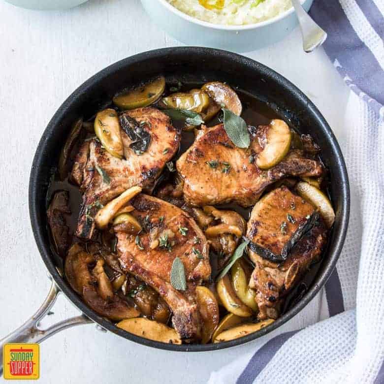 Baked Apple Pork Chops in skillet ready to serve for dinner