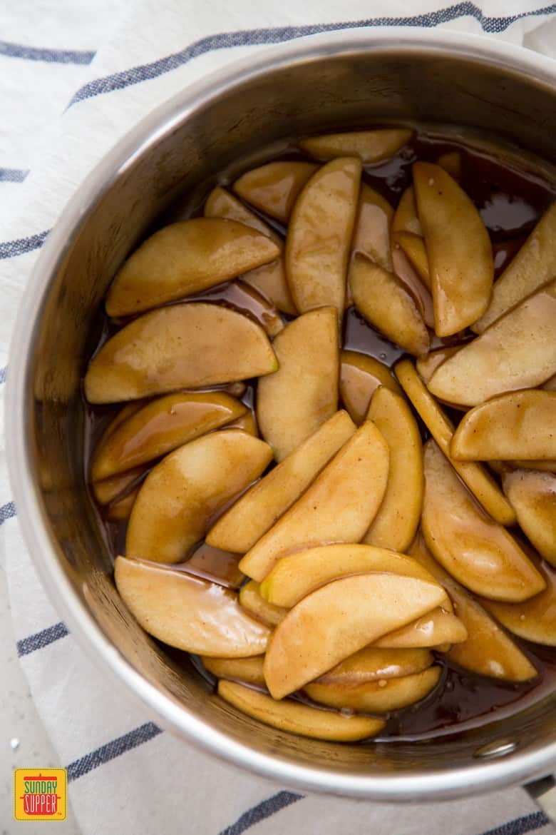 Sauteed apples after cooking in a metal bowl