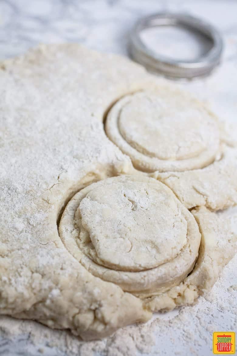 Cutting gluten free biscuits dough into biscuit rounds