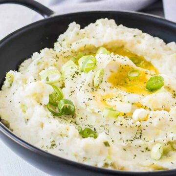 Irish mashed potatoes in a black dish with handles