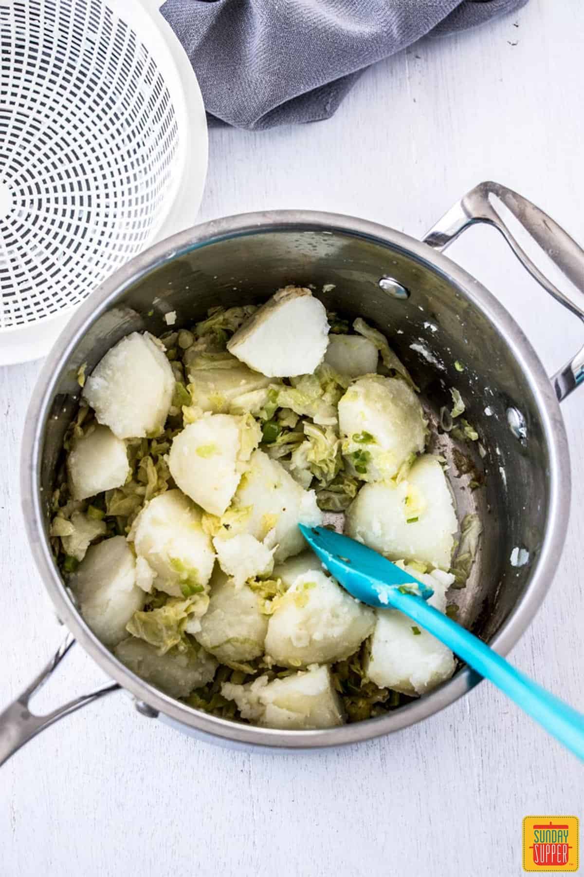 Potatoes added back to the pan 