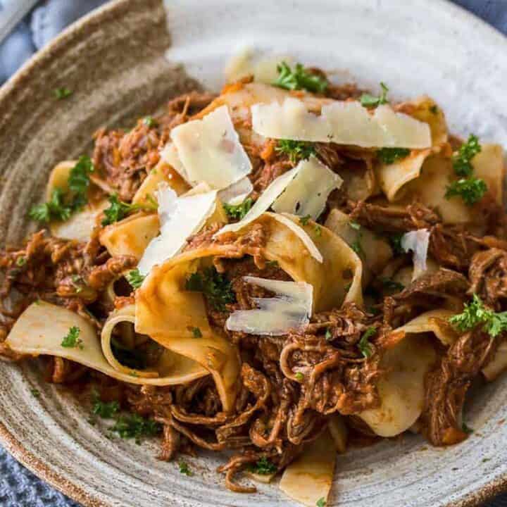 Slow Cooker Beef Ragu is a full flavored, slow cooked ragu perfect for a cold winters night. Served over thick strands of parpadelle, this is comfort food heaven.