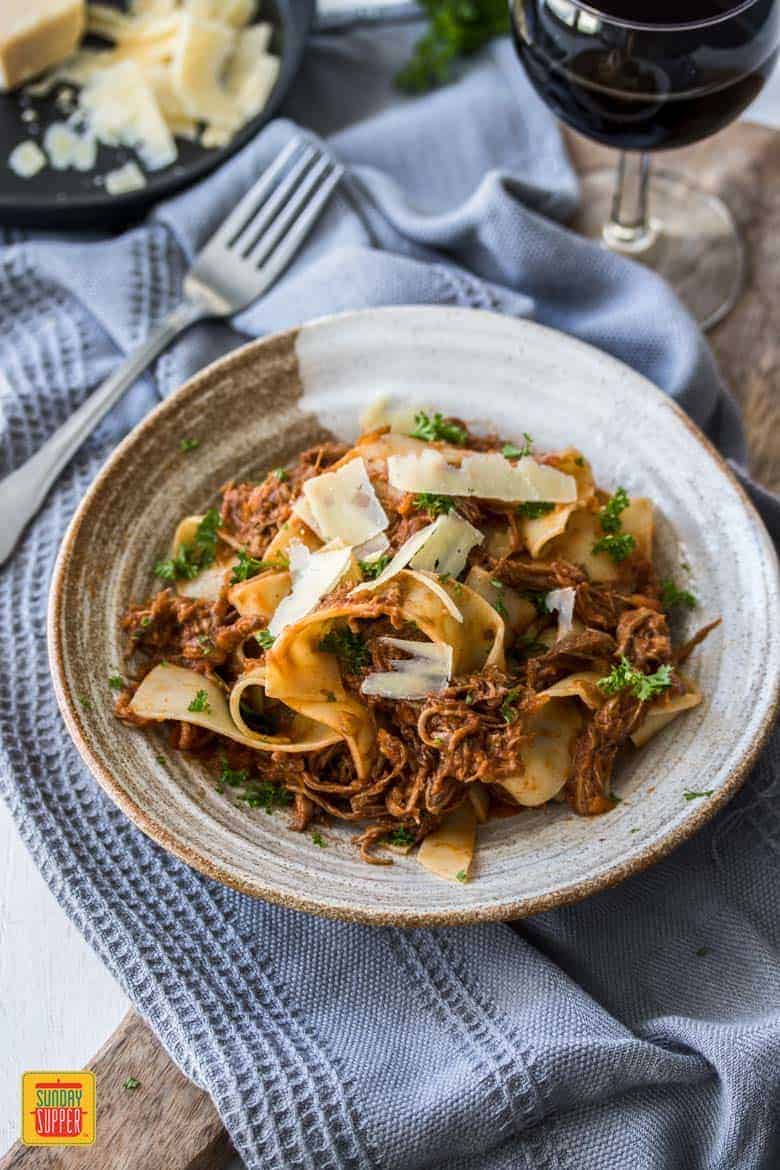 slow cooker ragu served on a plate with pappardelle