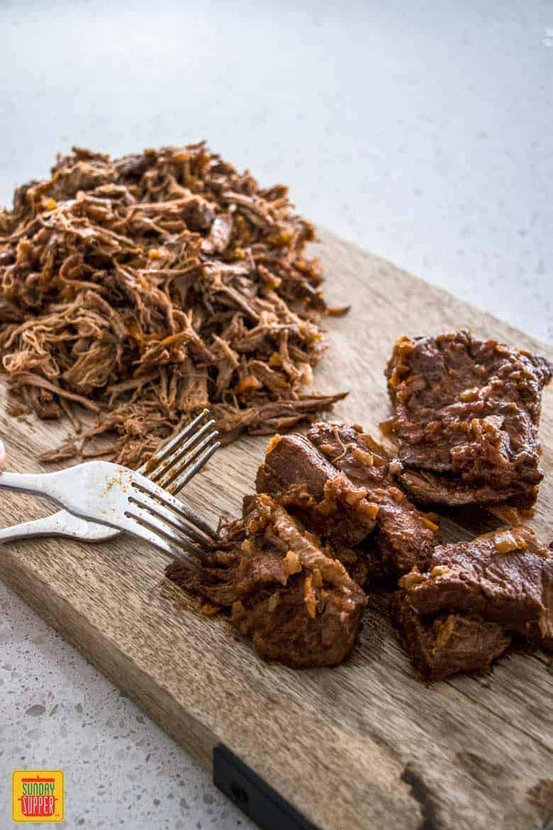 Shredding the beef for Slow Cooker Beef Ragu