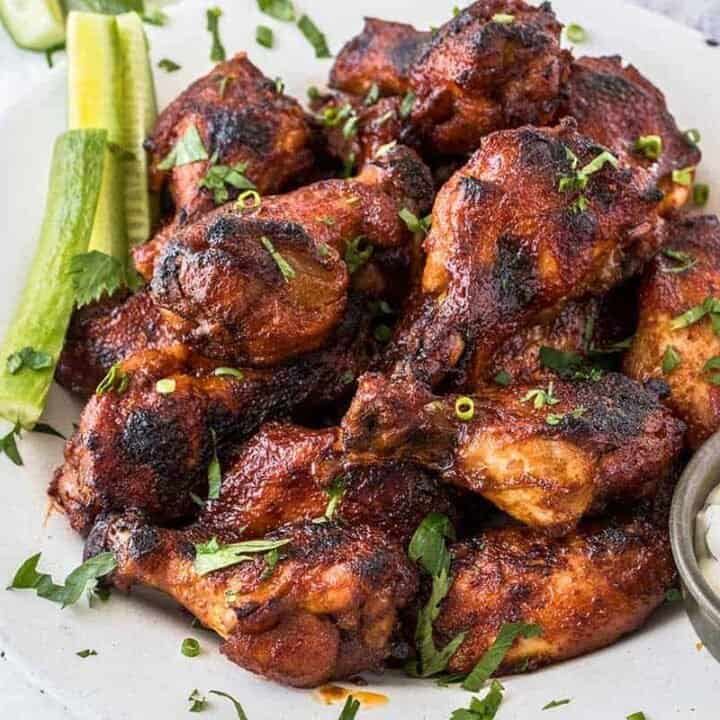 Slow Cooker Wings with Spicy BBQ Sauce on a white dish