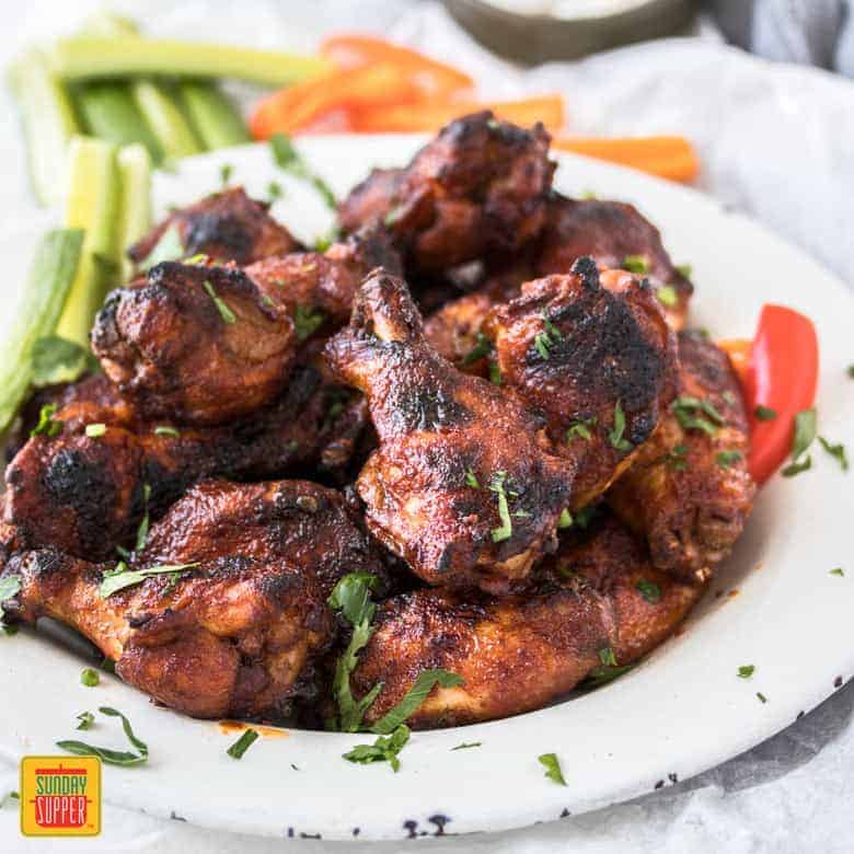 Slow Cooker Wings with Spicy BBQ Sauce are fall off the bone tender chicken wings, cooked low and slow and filled with flavor. These are perfect party food, game day food - share food at it's best.