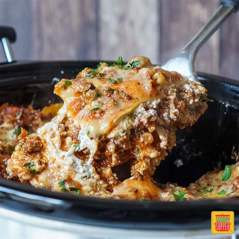 Removing slice of slow cooker lasagna