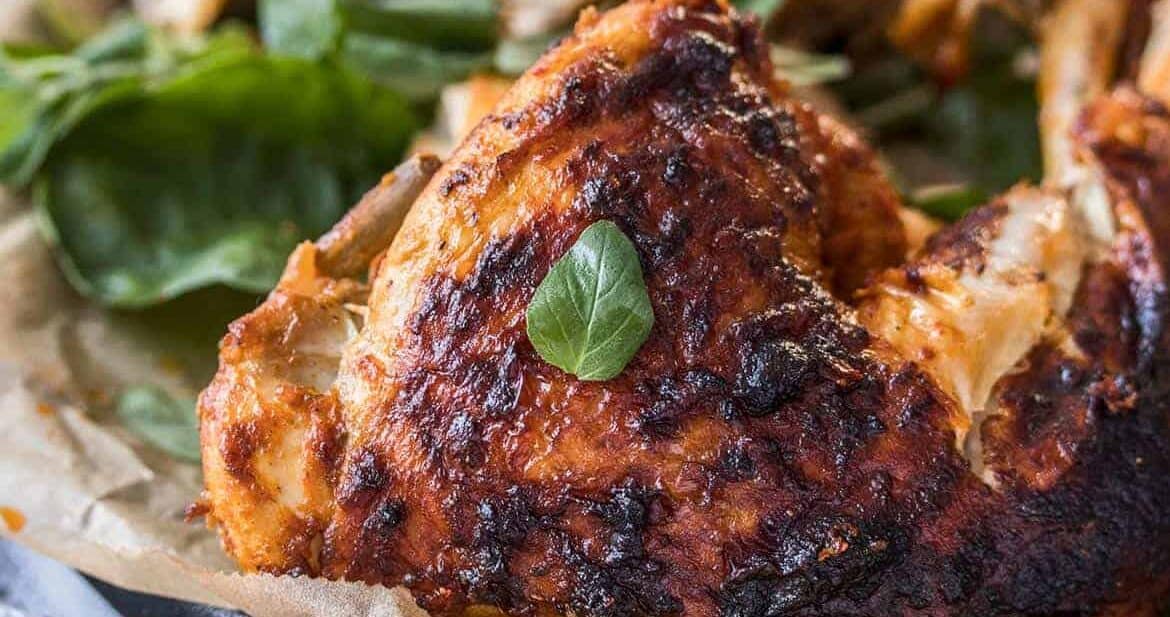 A roasted chicken, perfectly marinated in a simple spicy sauce. This Peri Peri Chicken recipe is brimming with flavor but is so simple to make.