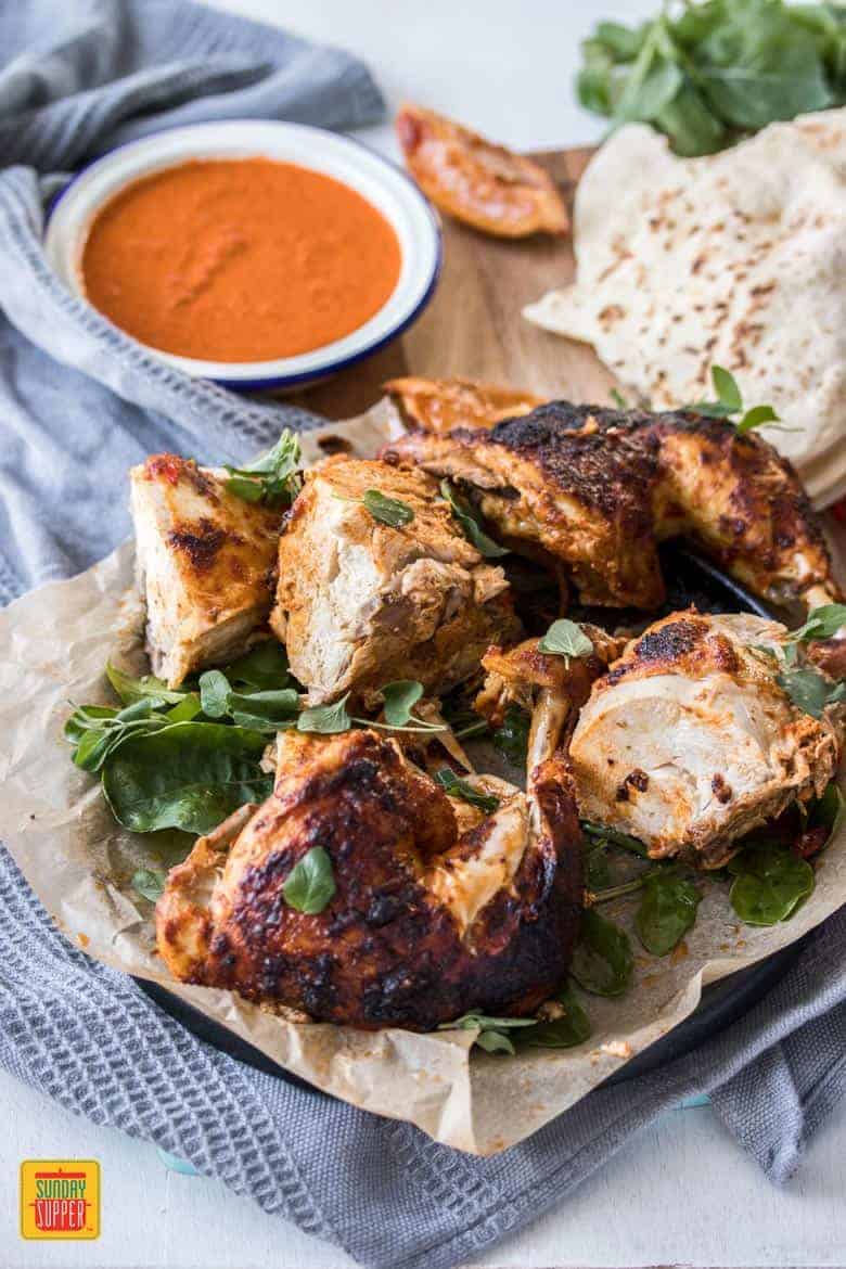 A roasted chicken, perfectly marinated in a simple spicy sauce. This Peri Peri Chicken recipe is brimming with flavor but is so simple to make.