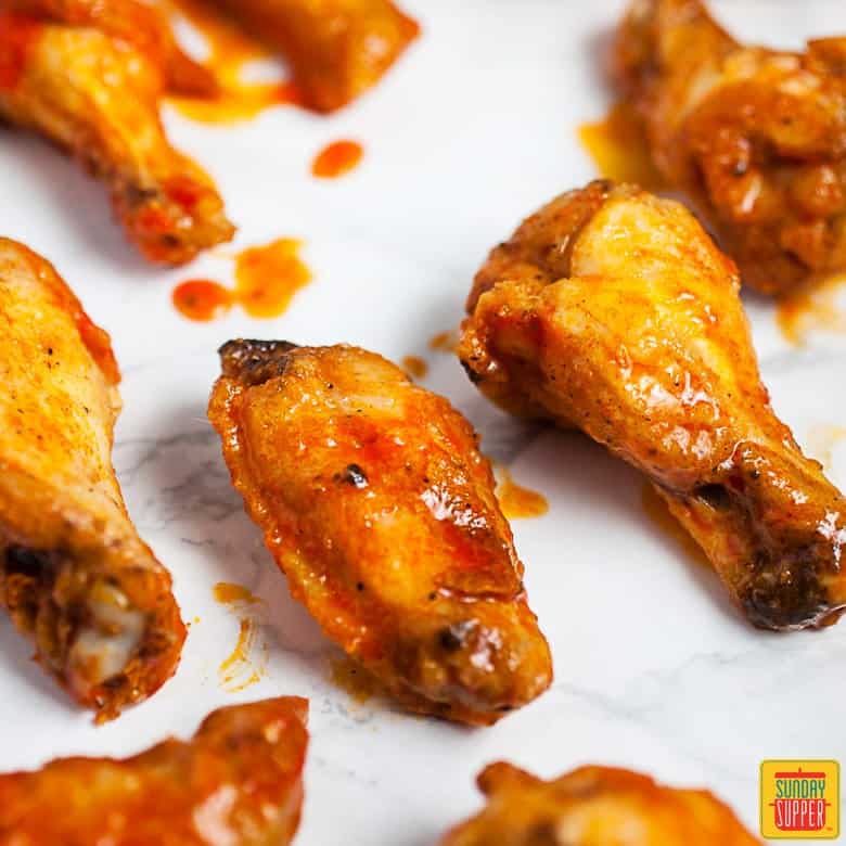 How to Make Buffalo Wings: buffalo chicken wings prepared and ready to eat with buffalo sauce