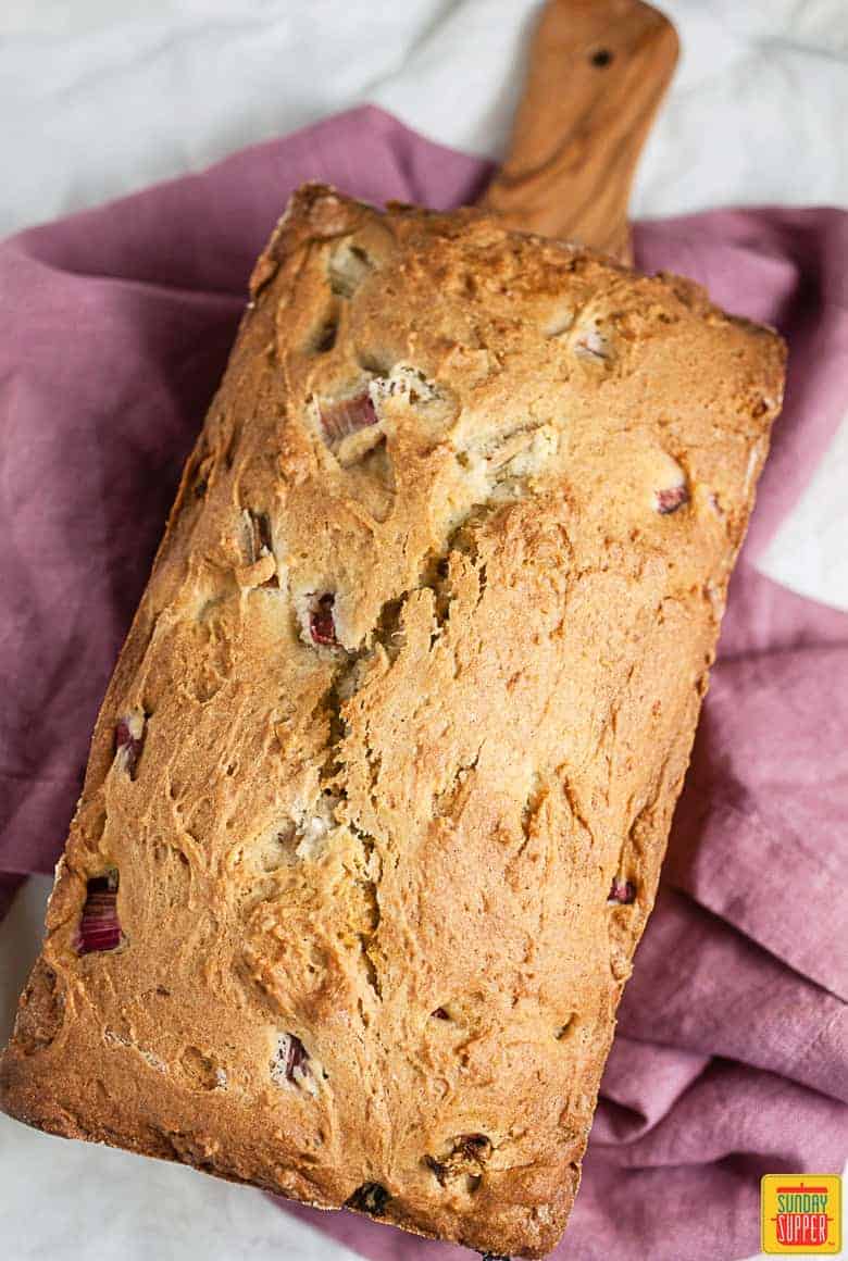 Rhubarb bread: rhubarb bread fresh out of the oven on a wooden bread paddle