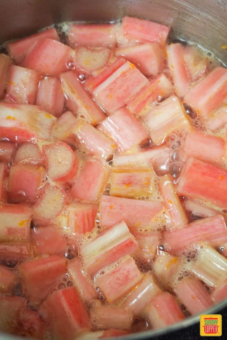 Stewed rhubarb simmering in a saucepan
