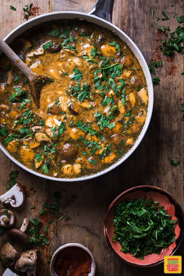 hungarian mushroom soup in a pan with a wooden spoon, ready to serve and enjoy