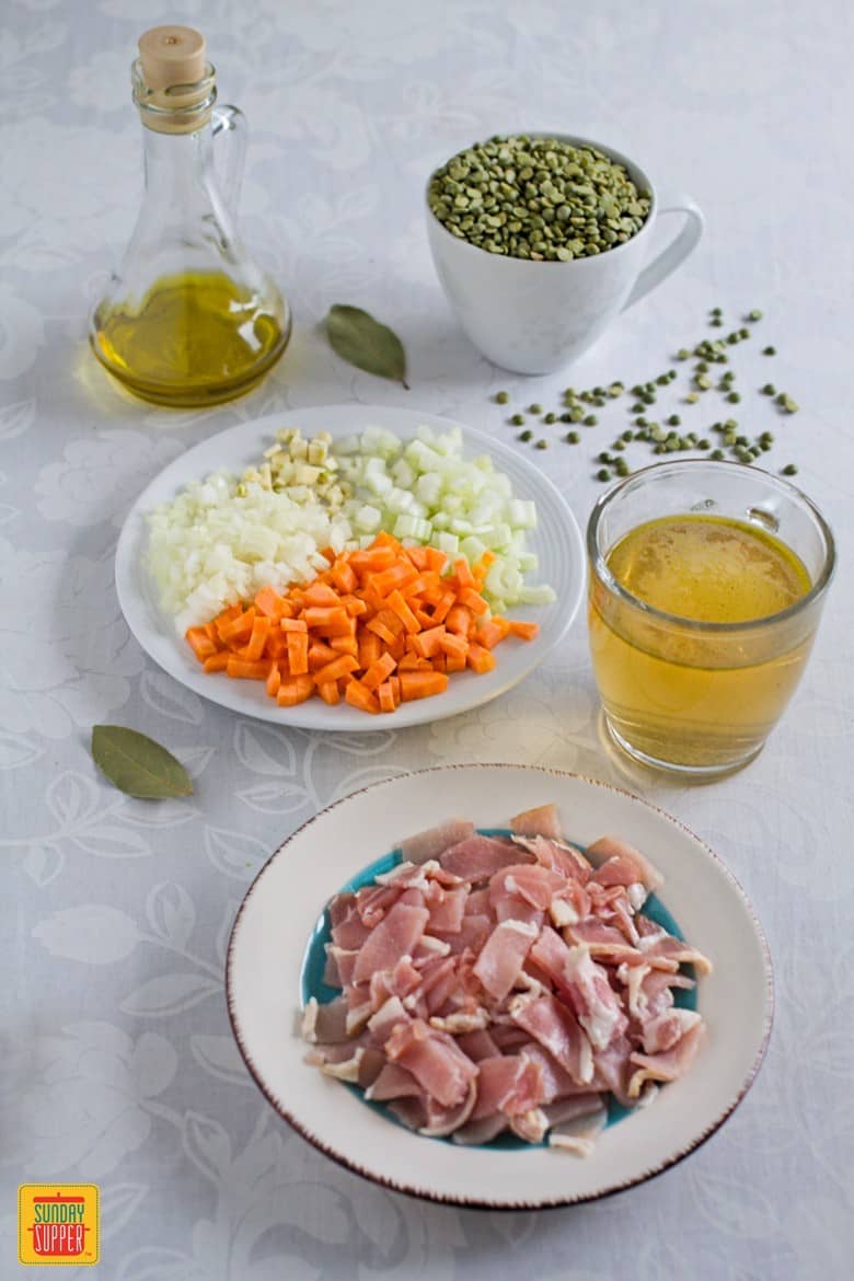 The ingredients to make split pea soup on a table
