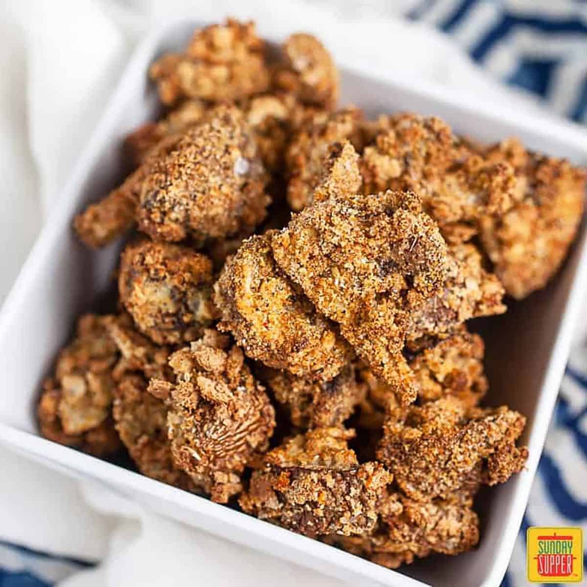 Air Fryer Mushrooms in a square white dish