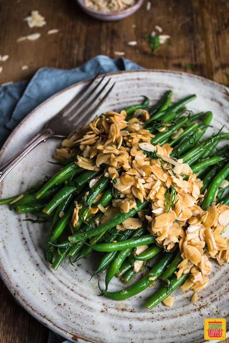 green beans served with almonds in butter on a plate