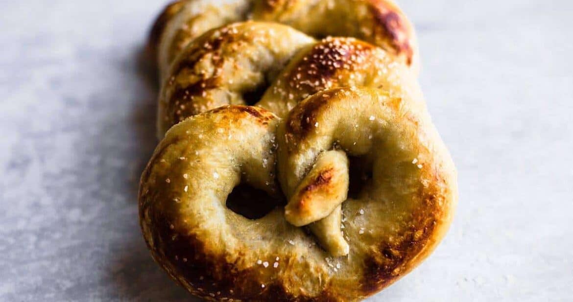 Soft Pretzel Recipe: three soft pretzels on a white background