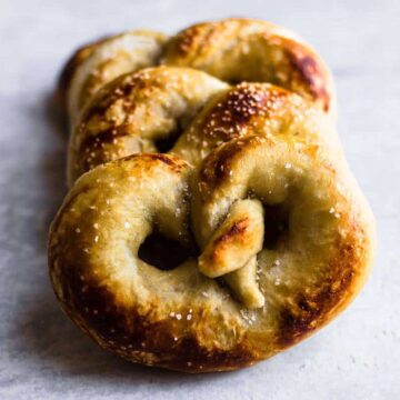 Soft Pretzel Recipe: three soft pretzels on a white background