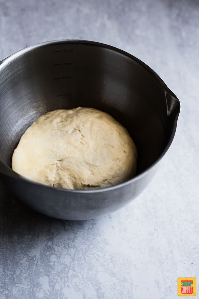 pretzel dough for soft pretzel recipe in a mixing bowl