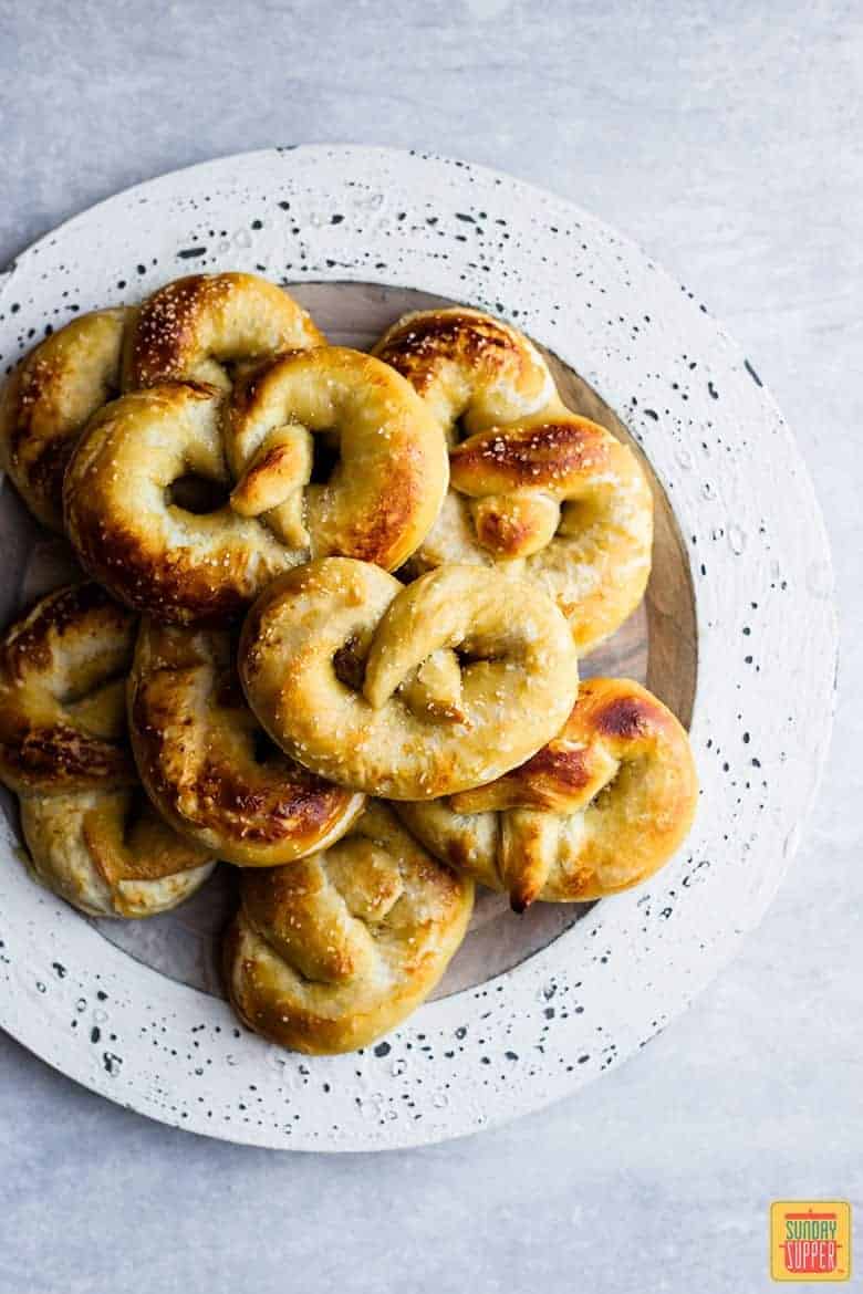 a white plate of fresh homemade soft pretzels from this soft pretzel recipe