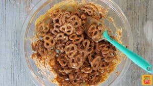 Mixed pretzels with peanut butter and chocolate in a glass bowl