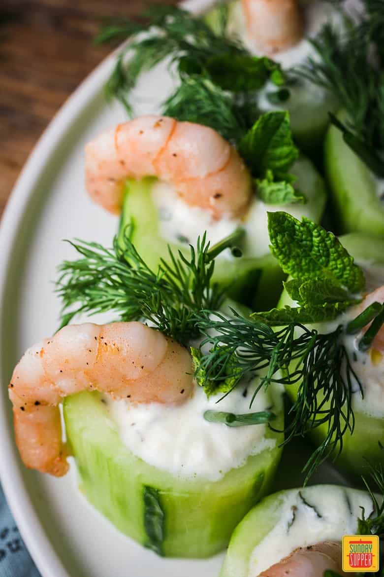 cucumber shrimp cups on a white serving plate