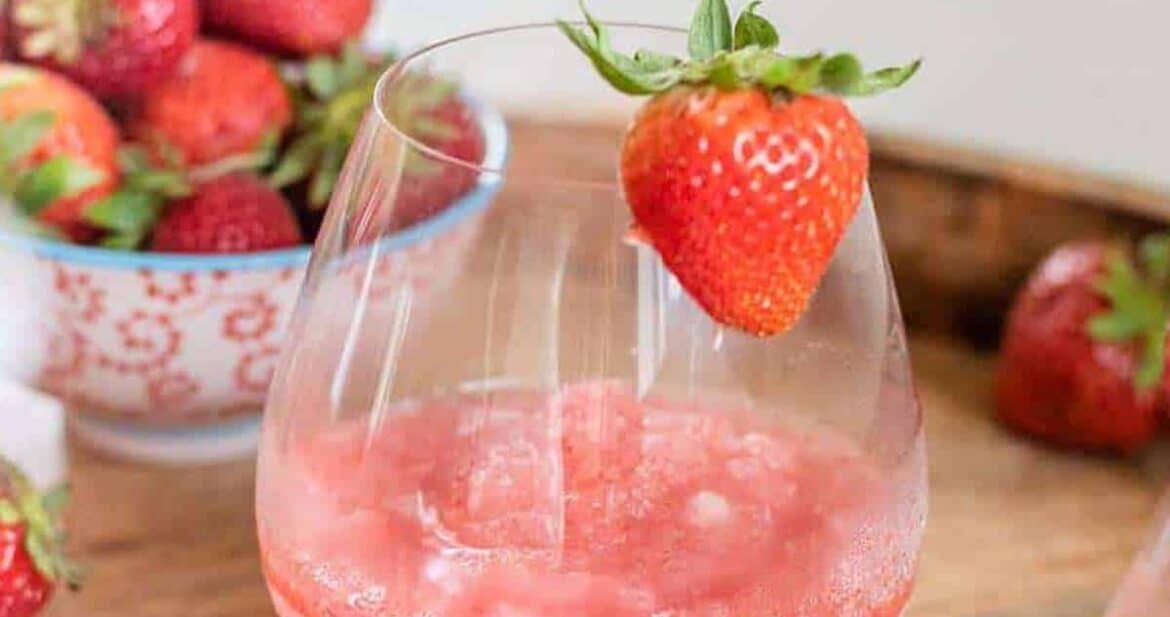 frose recipe in glasses with fresh strawberries with a white pitcher just in frame