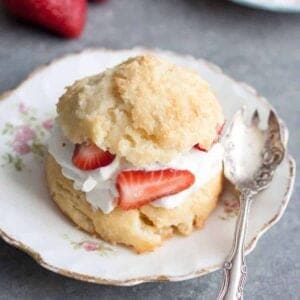 strawberry shortcake biscuit on a plate with a spoon