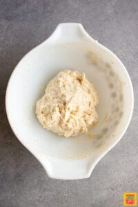 Dough formed in a mixing bowl for strawberry shortcake biscuits