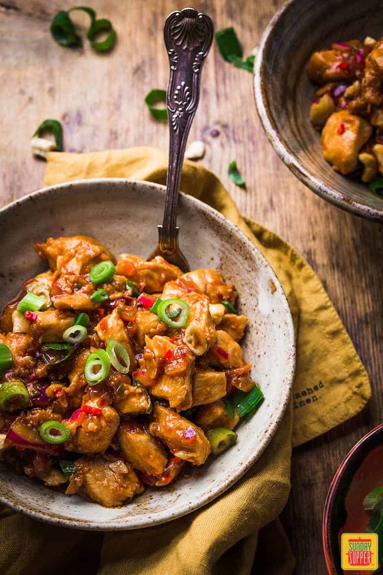 Chinese Dragon chicken recipe in a bowl with a fork ready to enjoy