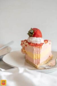 strawberry shortcake ice cream cake topped with whipped cream