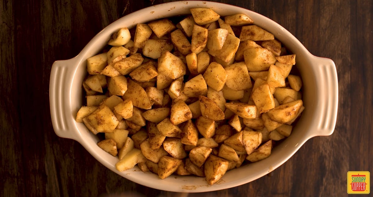 Apples spread into an oval baking dish