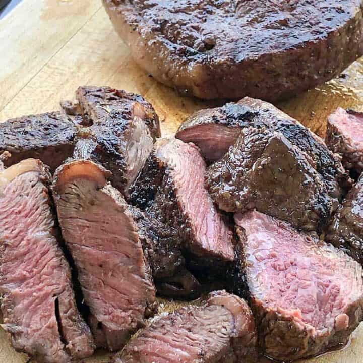 Cuts of cooked beef on a cutting board